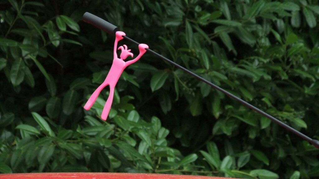 Car Aerial Topper figure holding on by its hands