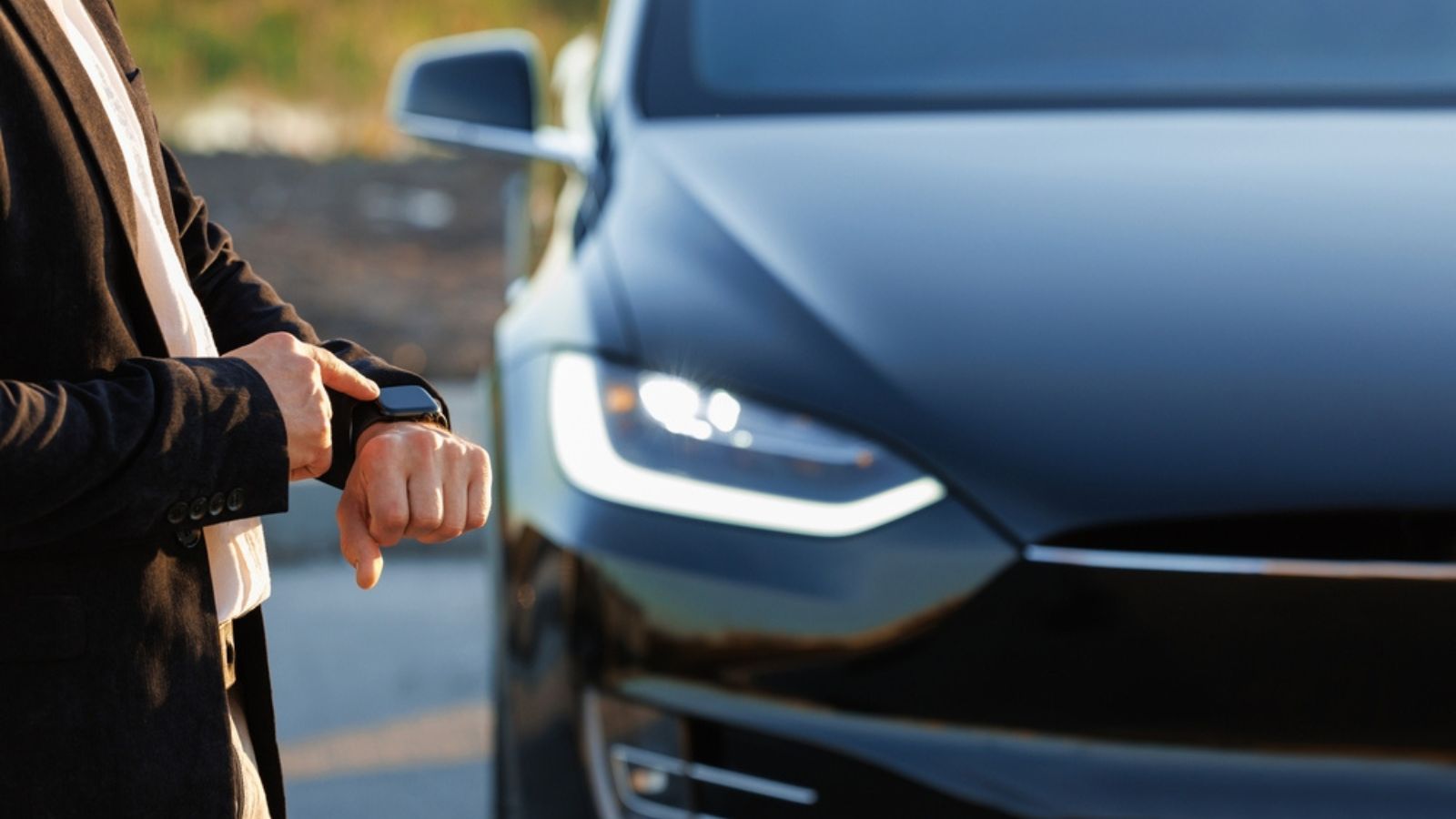 Man controlling his car from his watch