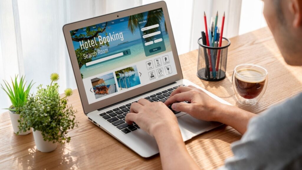 man doing hotel reservations online