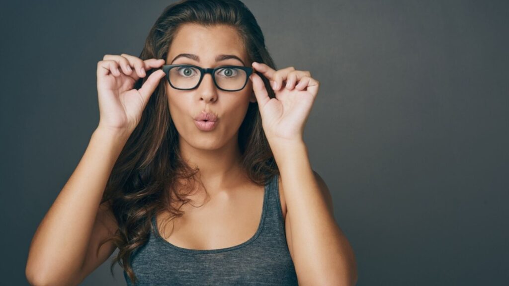 woman holding glasses