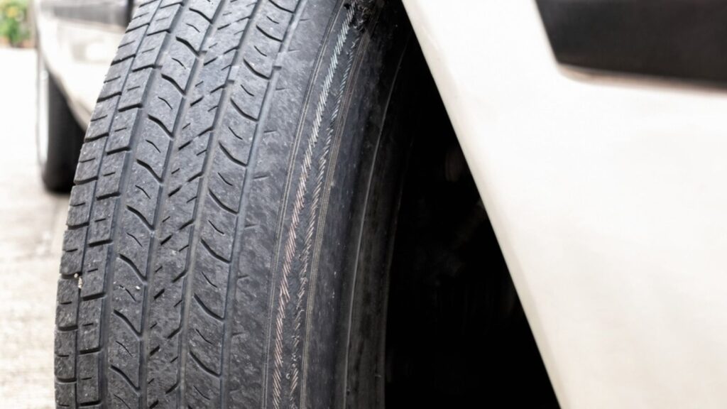 worn tire showing tire cords