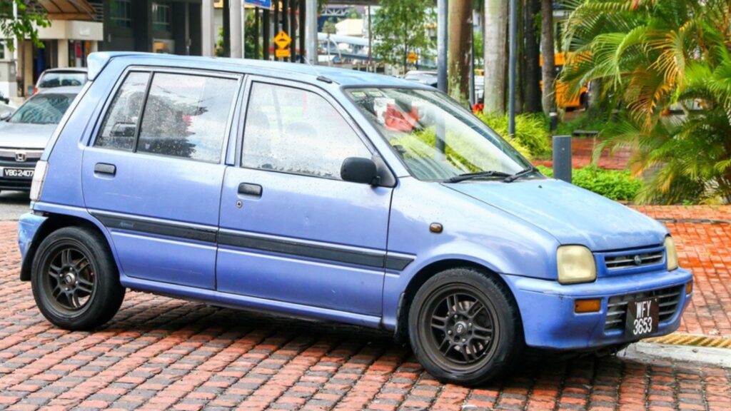 Small city car Perodua Kancil in the city street