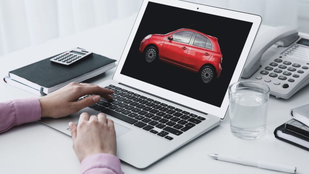 Buying online. Woman choosing car using laptop, closeup view