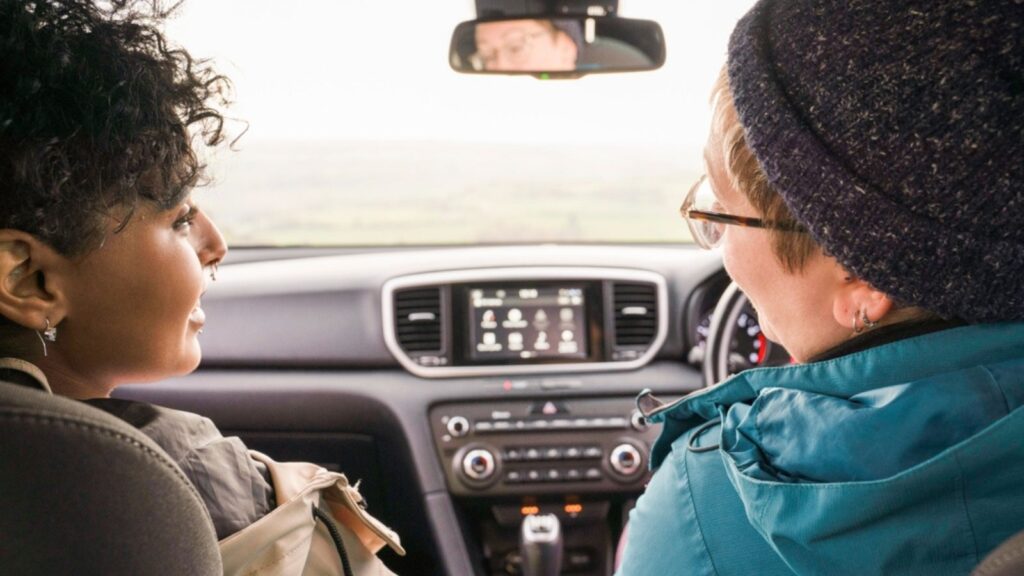 Female friends traveling by car