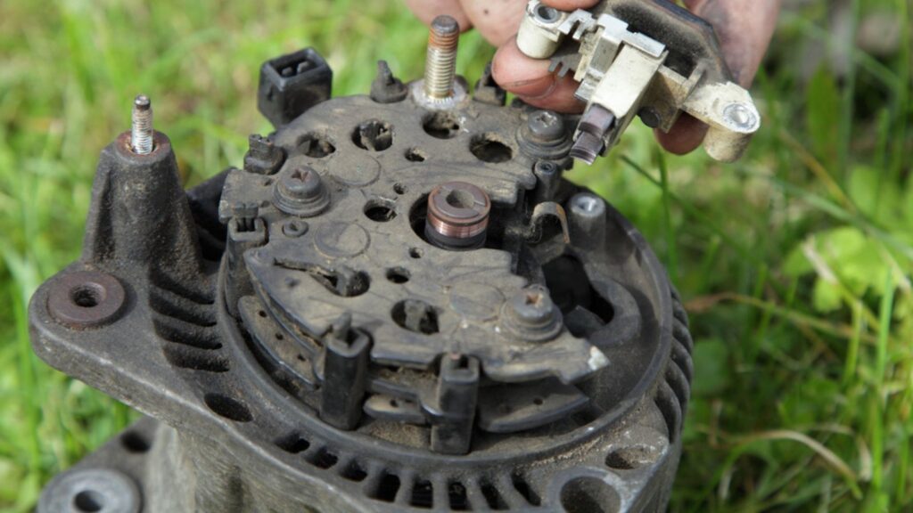 Relay voltage regulator in hands on used car 12 V alternator