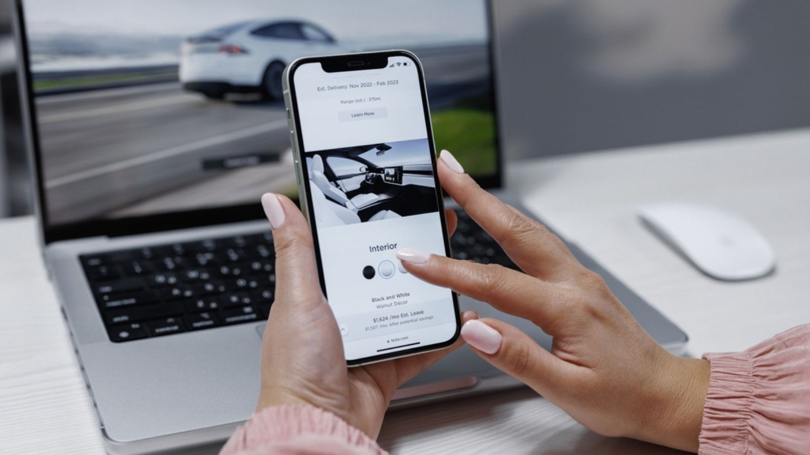 Smartphone Screen with Website Shopping for a Tesla car purchase online. Ordering Tesla model S performance and full self-driving autopilot